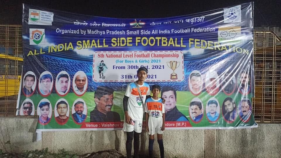 Players in front of the 5th National Level Football Championship banner