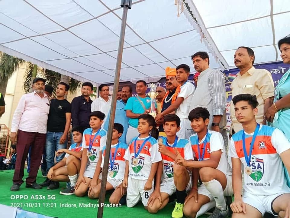 PSA youth squad with officials under a tent in Indore